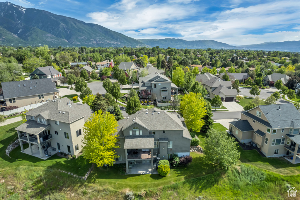 Aerial perspective of suburban area with a mountainous background