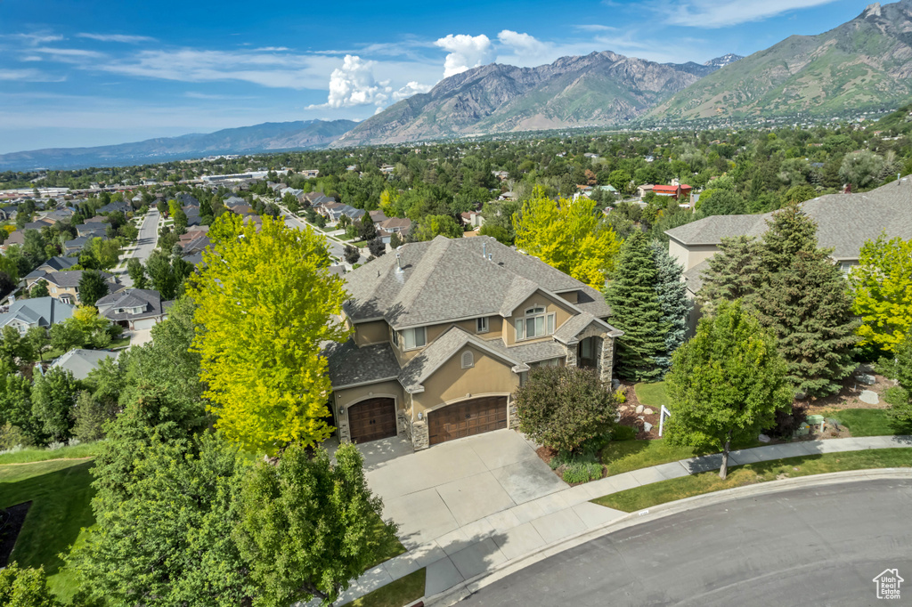 Aerial view of residential area featuring mountains
