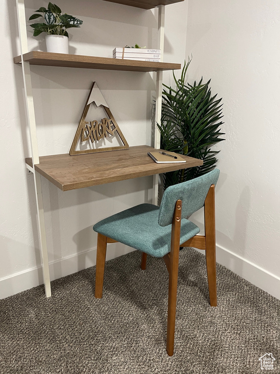 Interior details featuring a textured wall and baseboards