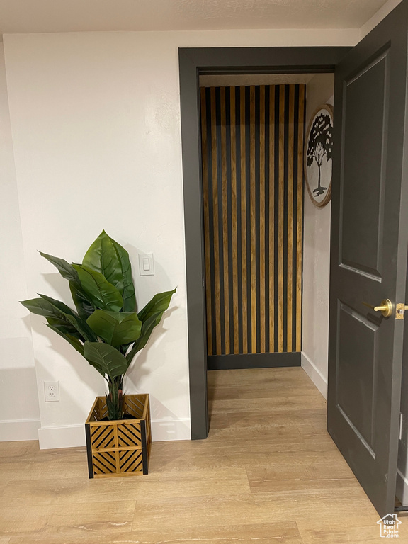 Room details with baseboards and wood finished floors