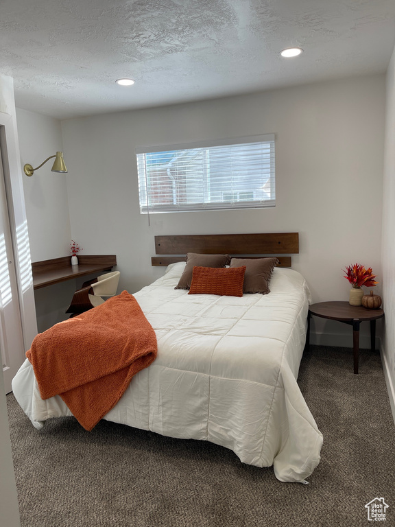 Bedroom with baseboards, carpet flooring, a textured ceiling, and recessed lighting