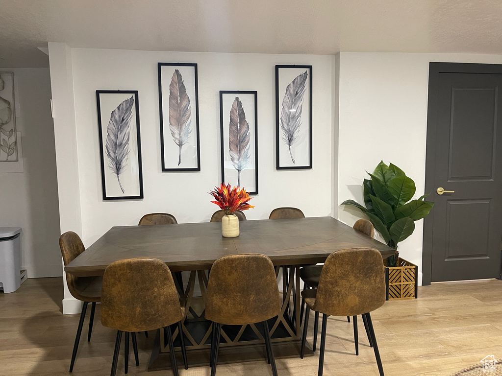 Dining room with light wood-style floors