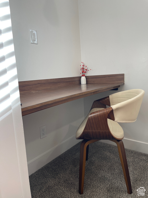 Office featuring built in study area, carpet floors, and baseboards