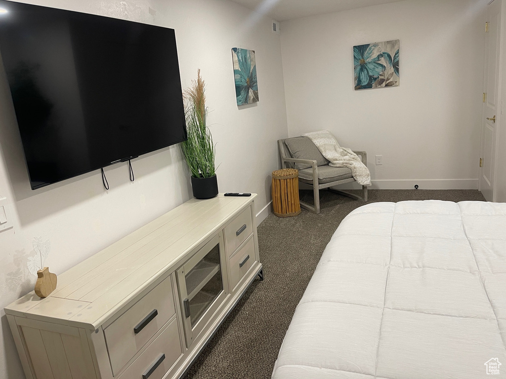 Carpeted bedroom with baseboards