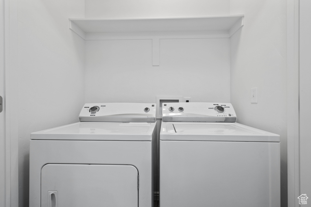 Laundry area featuring independent washer and dryer and laundry area