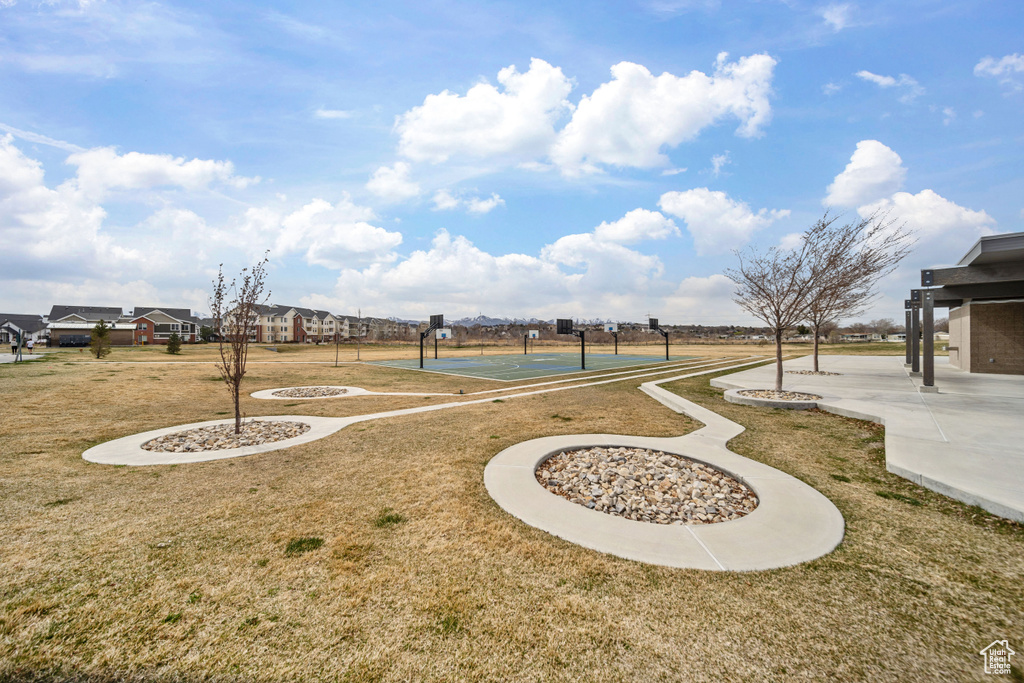 View of yard with community basketball court