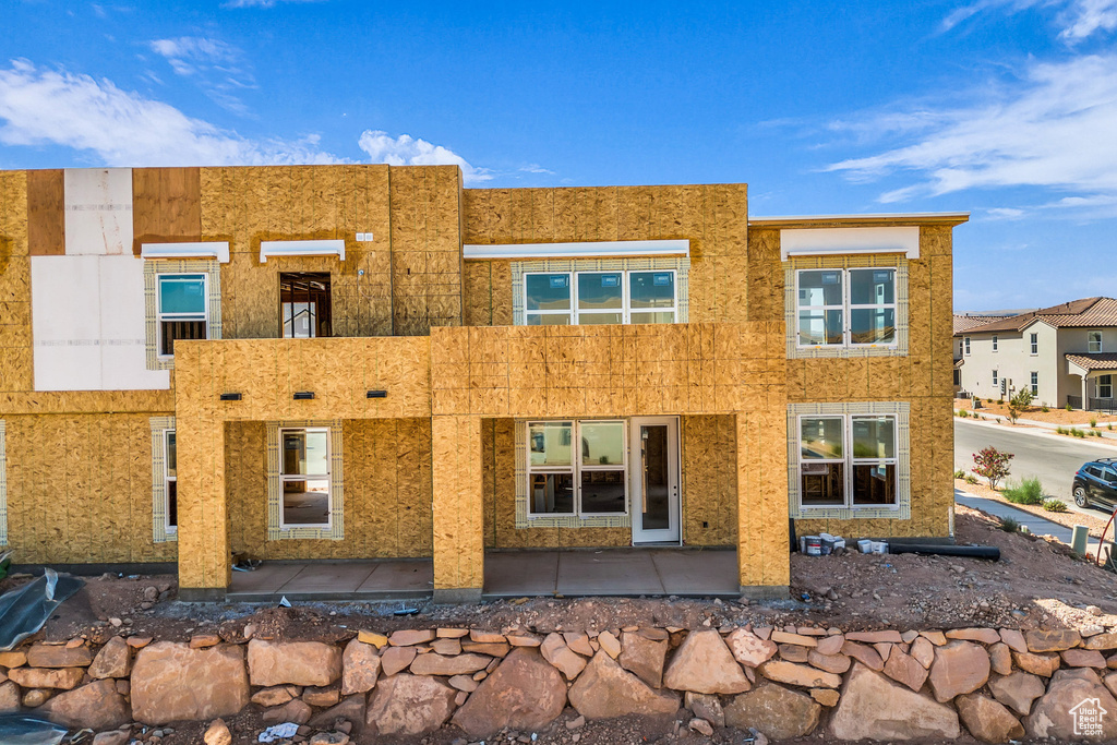 Back of property with stucco siding