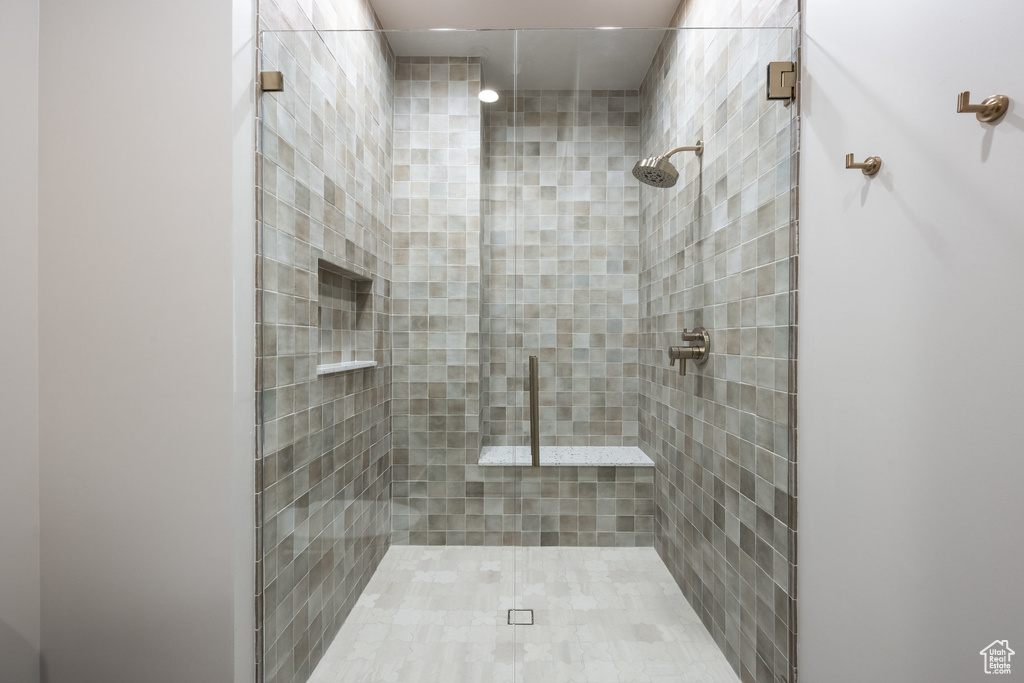 Full bathroom featuring a shower stall