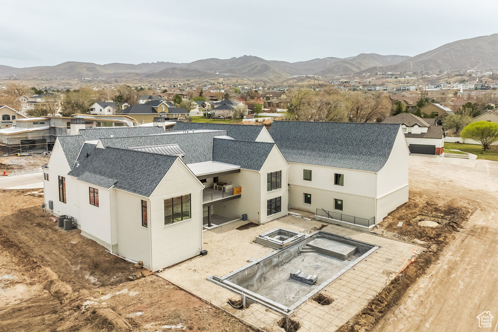 Drone / aerial view with a residential view and a mountain view