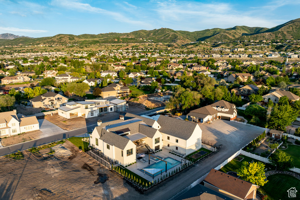 Aerial view of residential area with a mountainous background