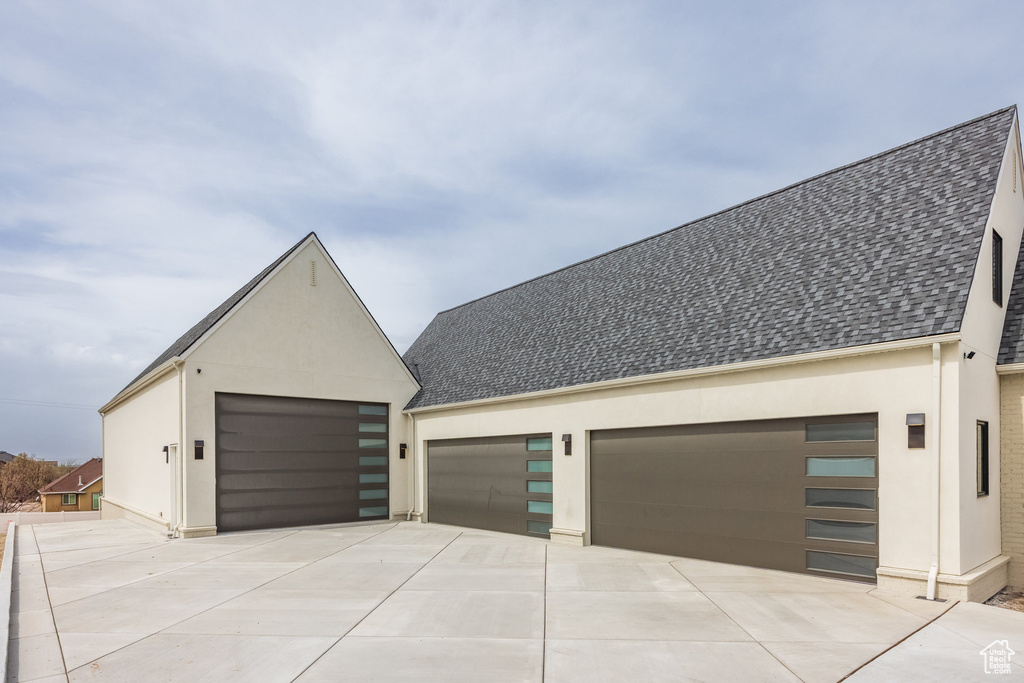 Garage featuring driveway