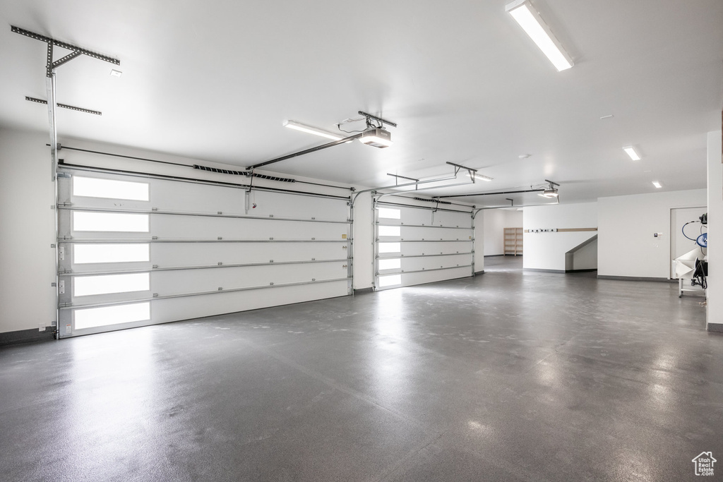 Garage featuring a garage door opener