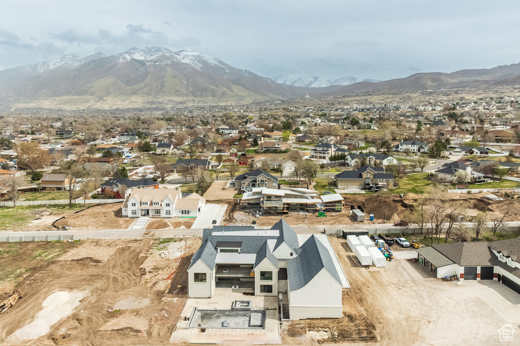 Birds eye view of property featuring a mountain view and a residential view