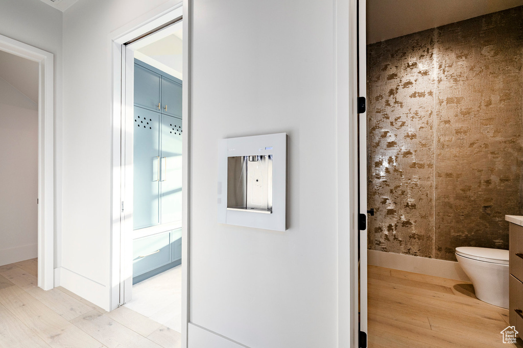 Hallway with light wood-style floors