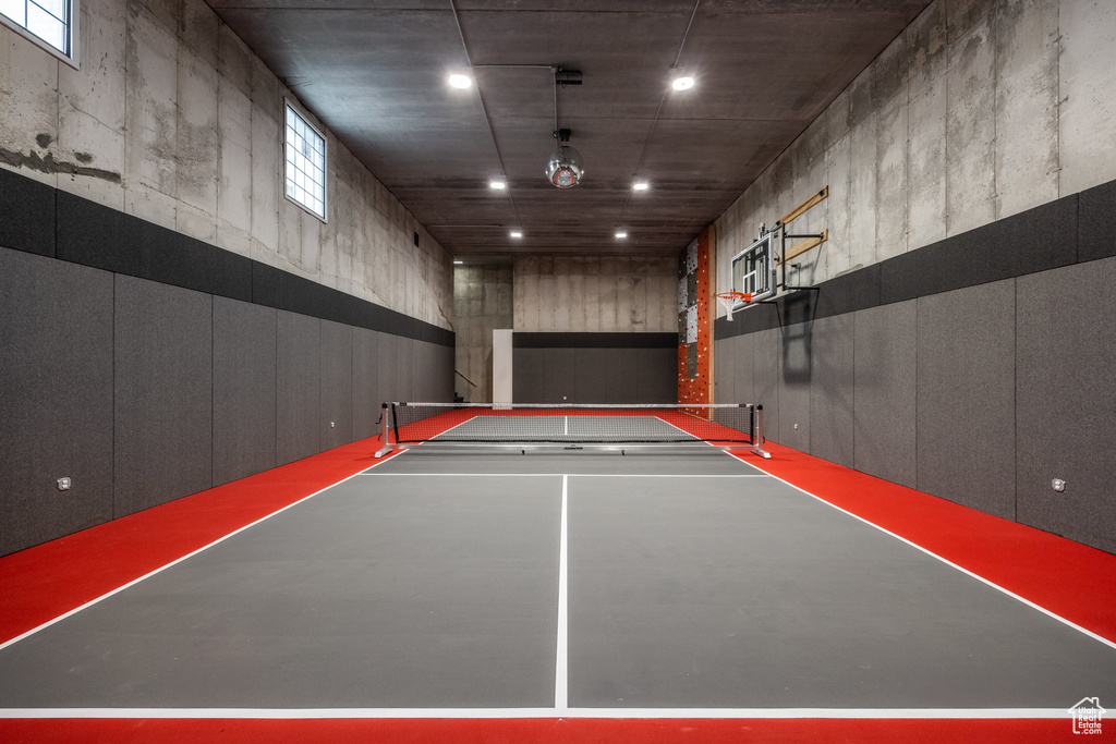 Interior space with basketball court and fence
