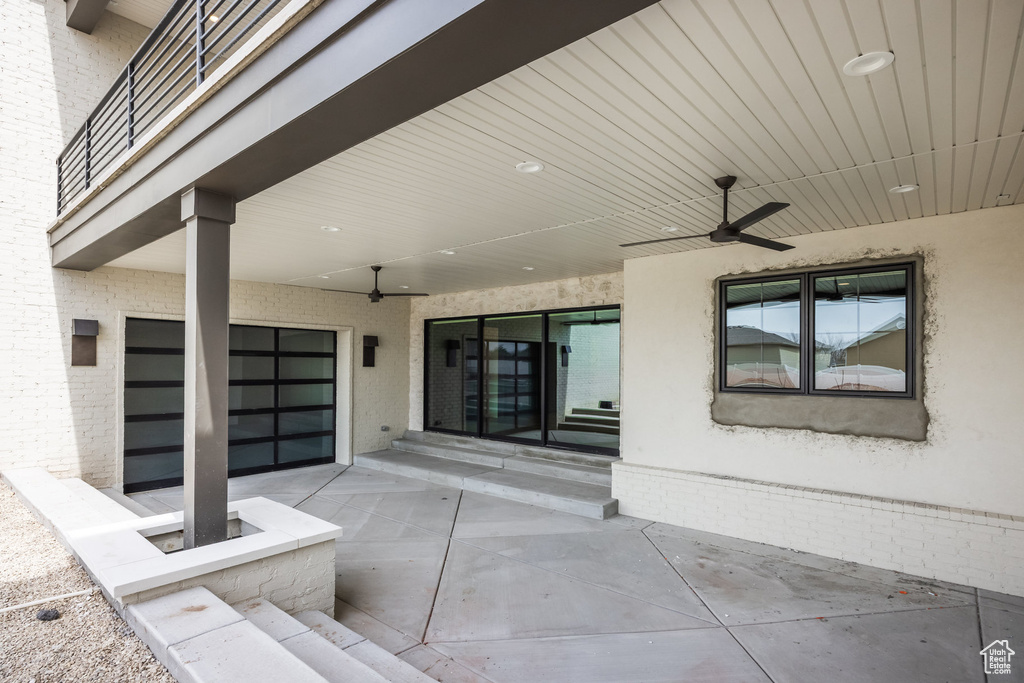View of patio / terrace with entry steps and ceiling fan