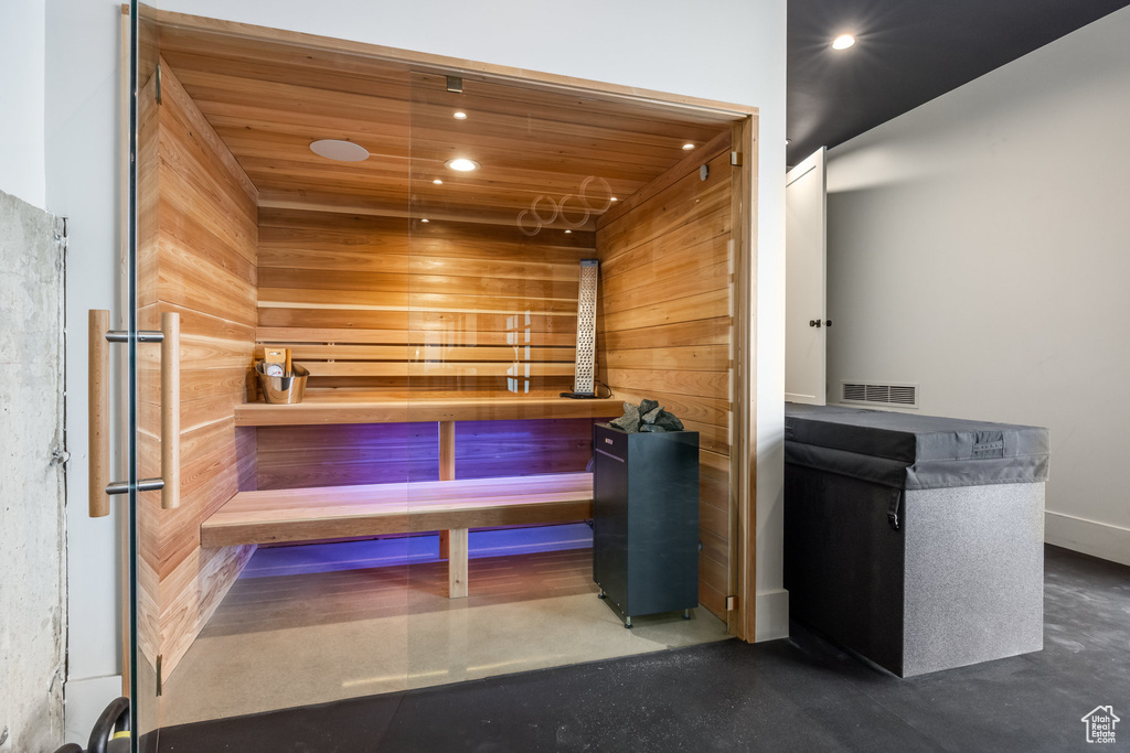 View of sauna featuring finished concrete flooring and recessed lighting