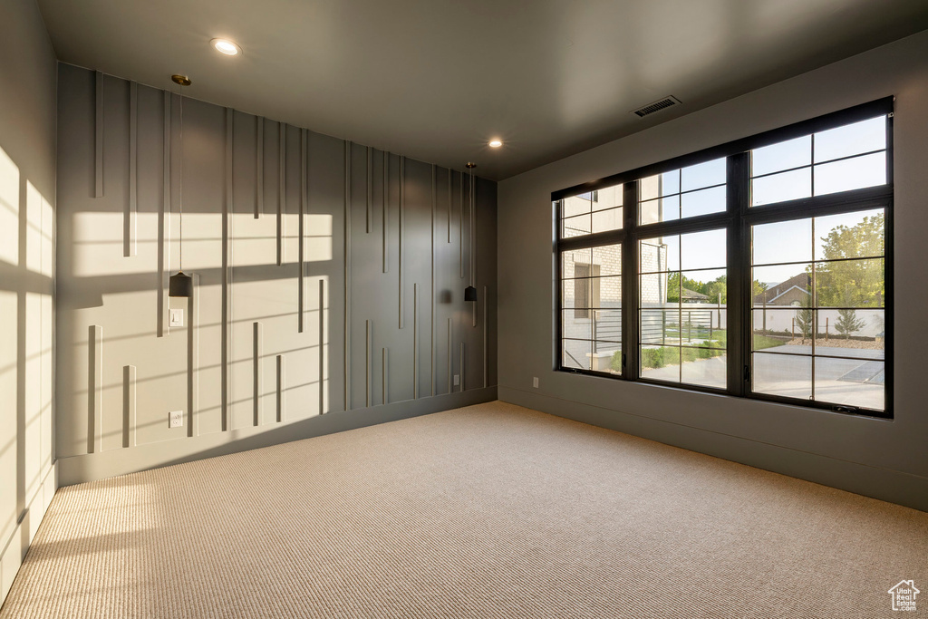 Unfurnished room with carpet floors and recessed lighting