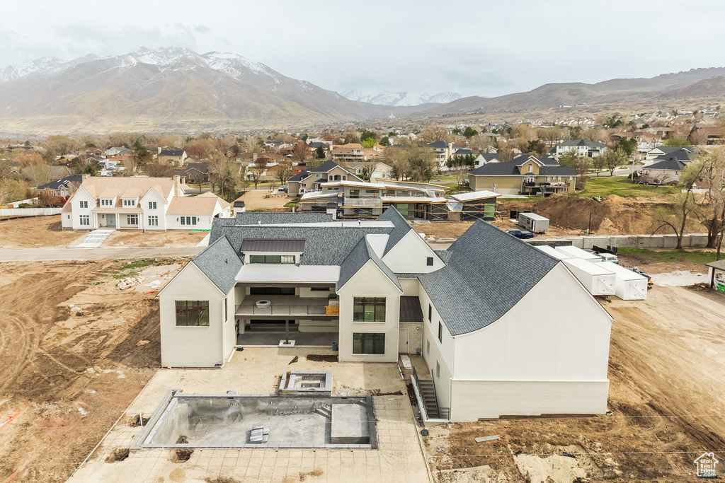 Birds eye view of property featuring a mountain view and a residential view