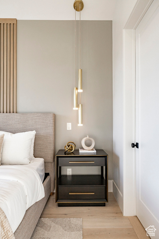 Bedroom with wood finished floors