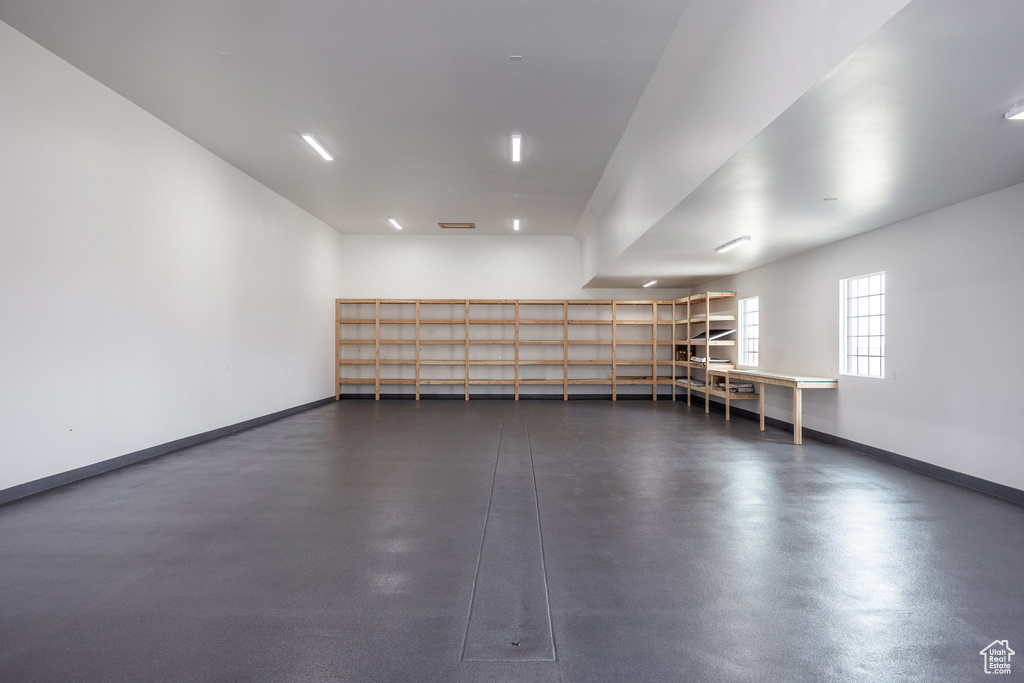 Garage featuring baseboards