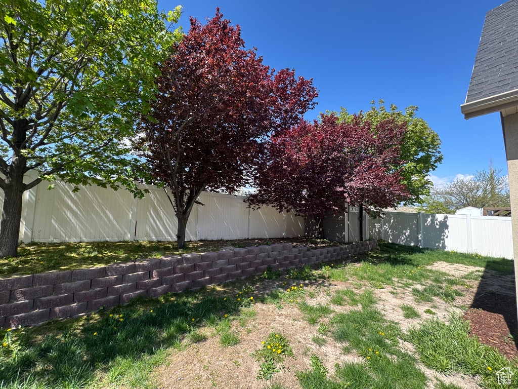 View of yard with a fenced backyard