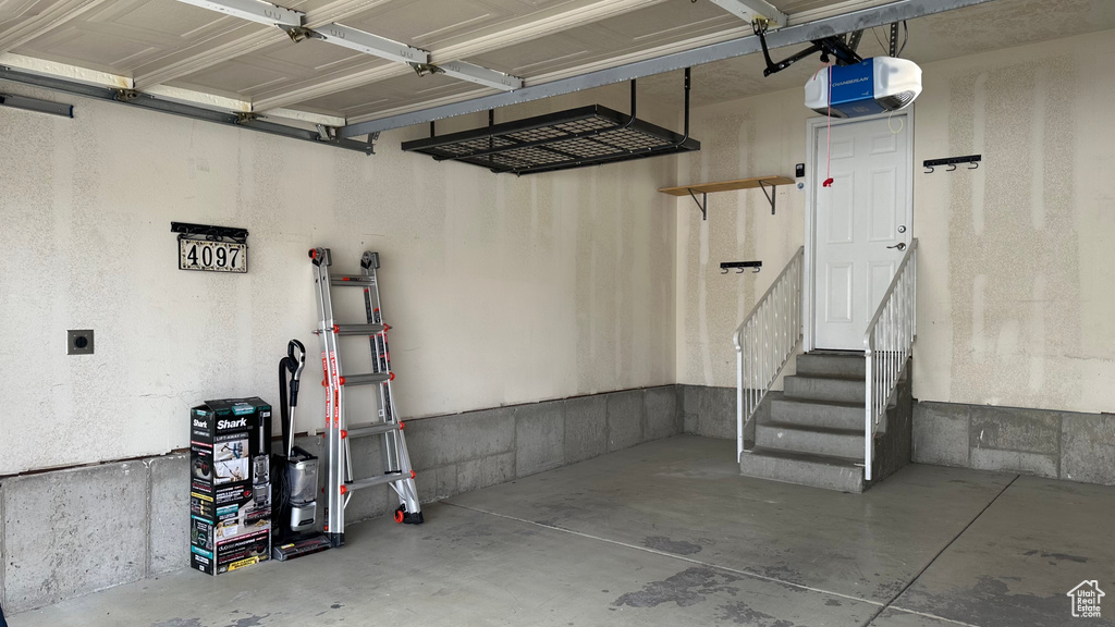 Garage featuring a garage door opener