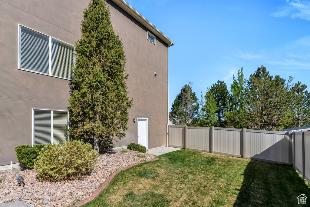 View of yard with a fenced backyard