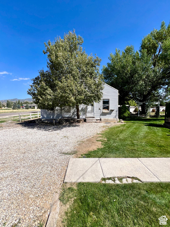 Exterior space featuring a front yard