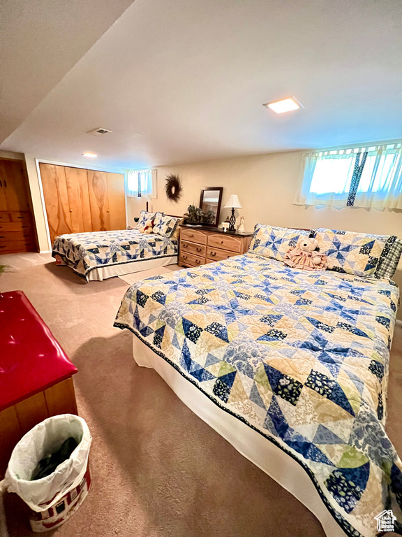 Bedroom with carpet and visible vents