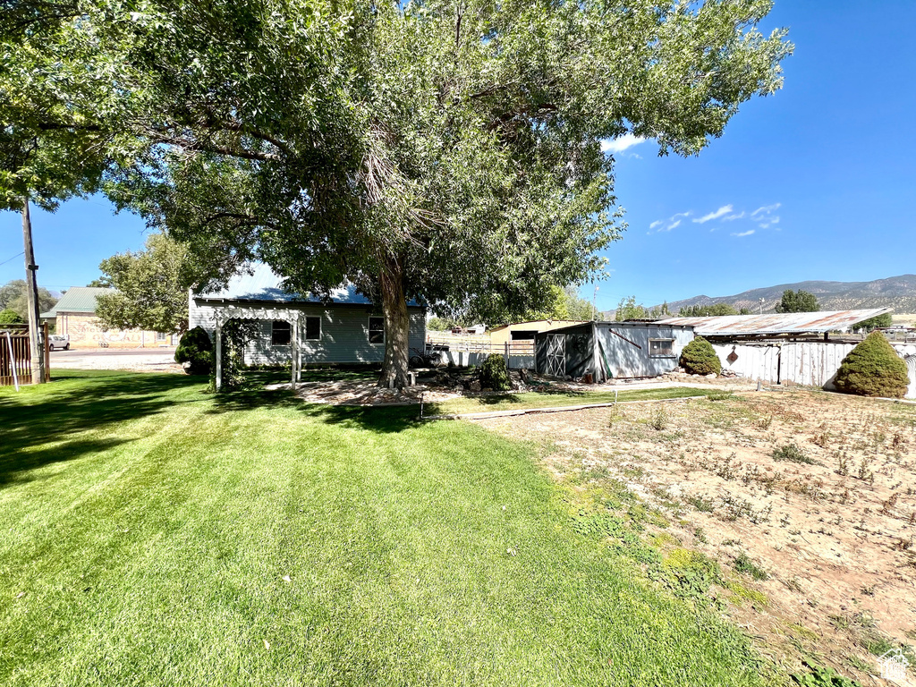View of yard featuring fence
