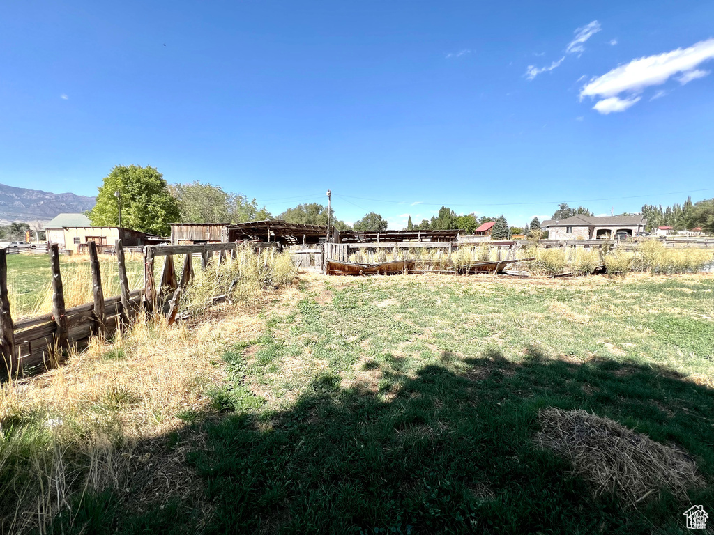 View of yard featuring fence