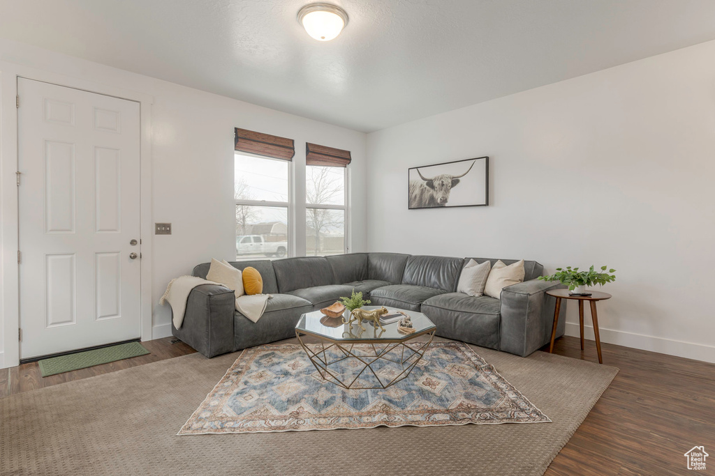 Living room with baseboards and wood finished floors