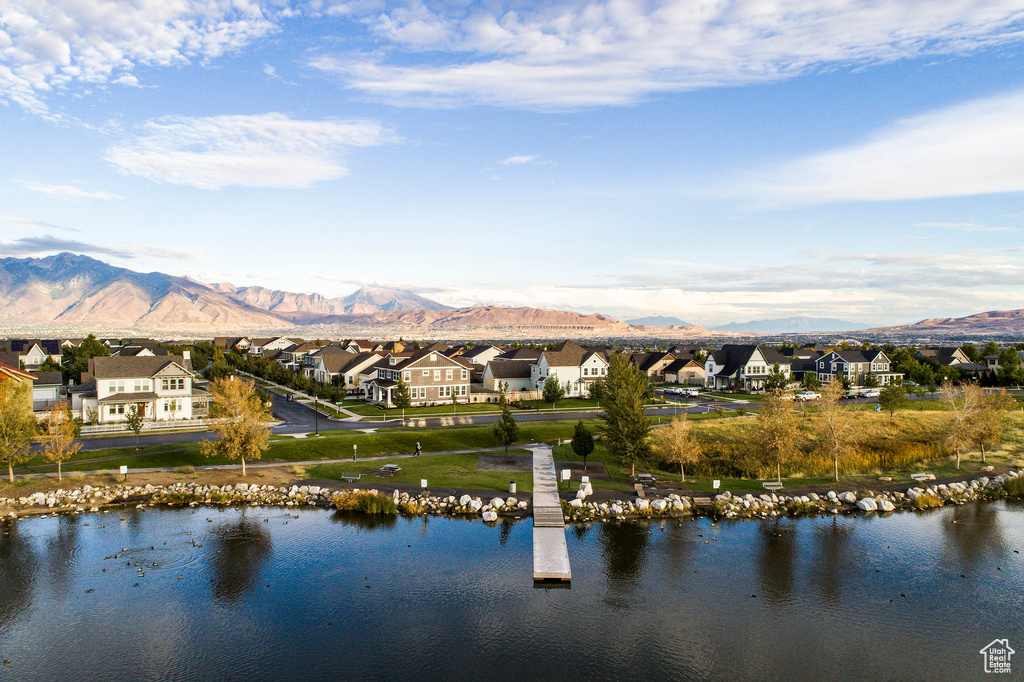 Water view featuring a residential view and a mountain view