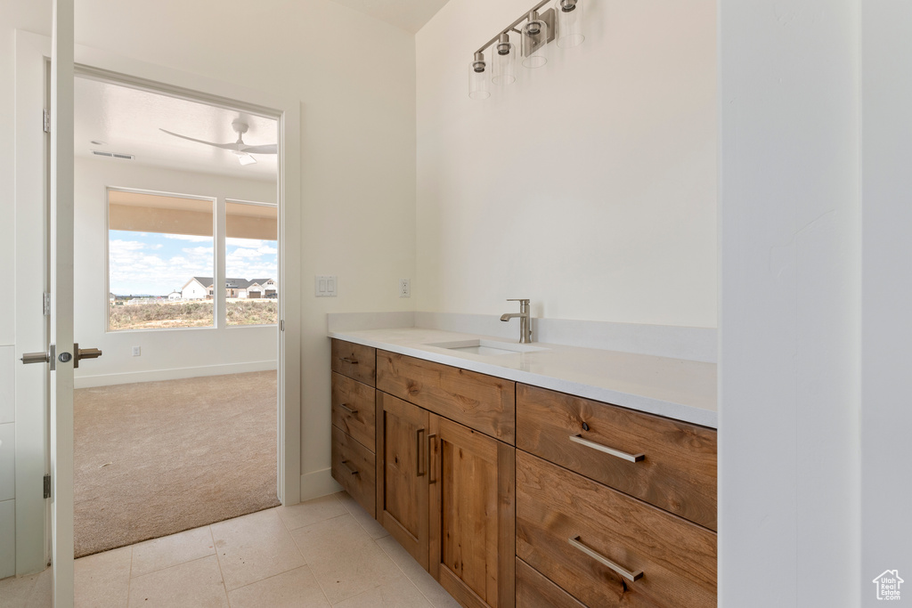 Bathroom with vanity and baseboards