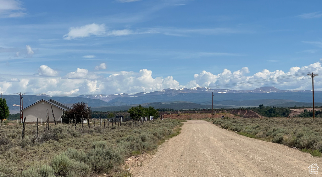 View of mountain backdrop with rural landscape