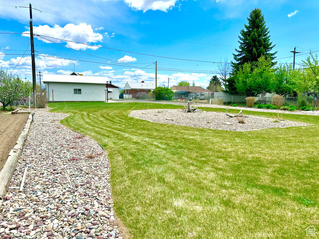 View of yard featuring fence