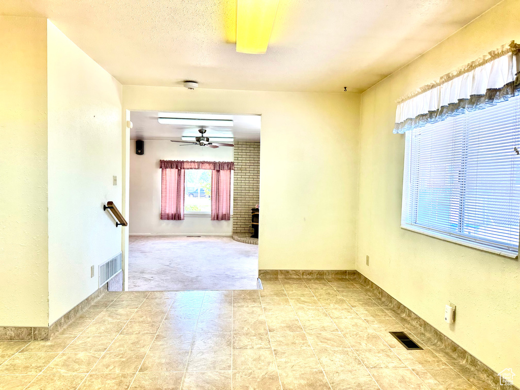 Unfurnished room featuring ceiling fan