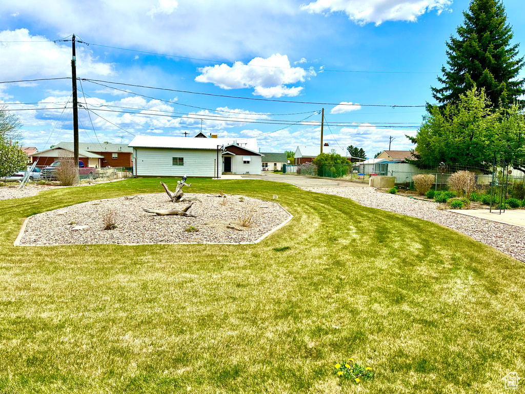 View of yard featuring fence