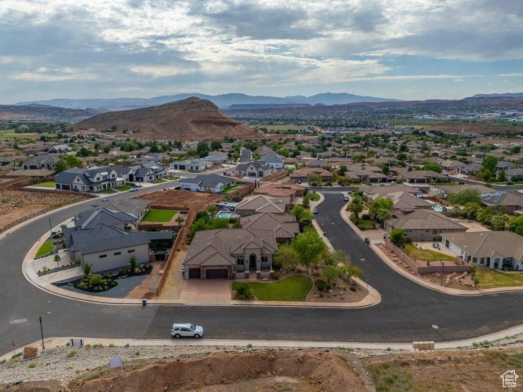 Birds eye view of property with a residential view and a mountain view