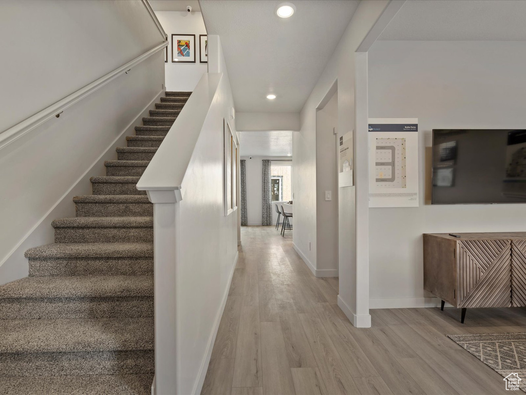 Interior space with recessed lighting, baseboards, and wood finished floors