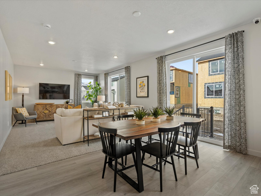 Dining area with recessed lighting, baseboards, and light wood-style floors