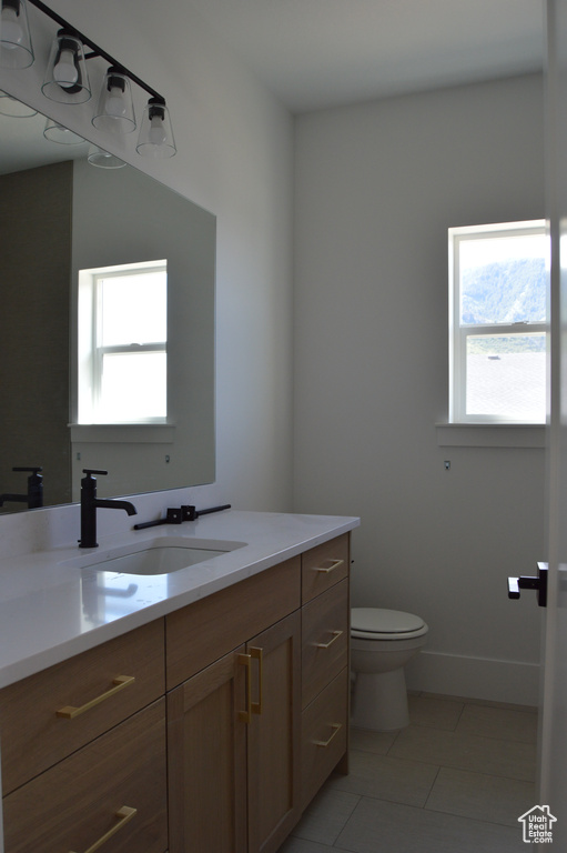 Bathroom with vanity and tile patterned floors
