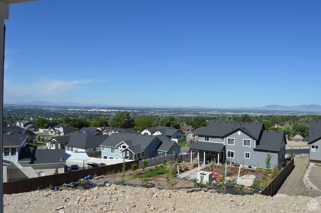 Aerial view of residential area featuring a mountainous background