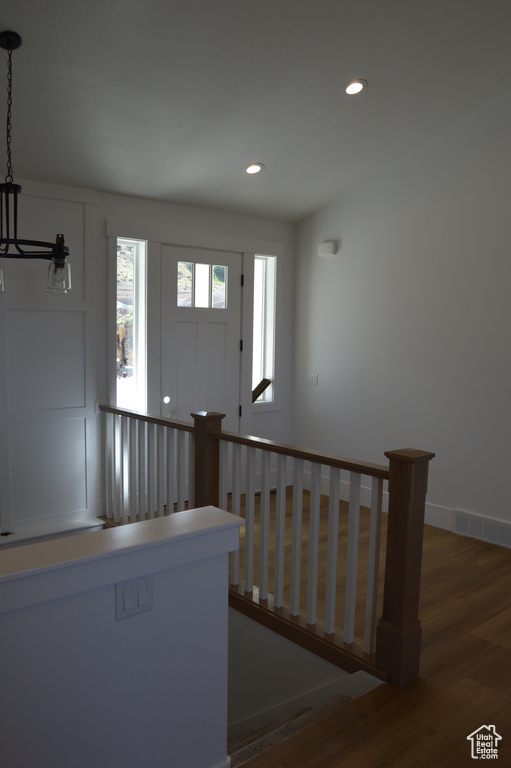 Entryway featuring wood finished floors and recessed lighting