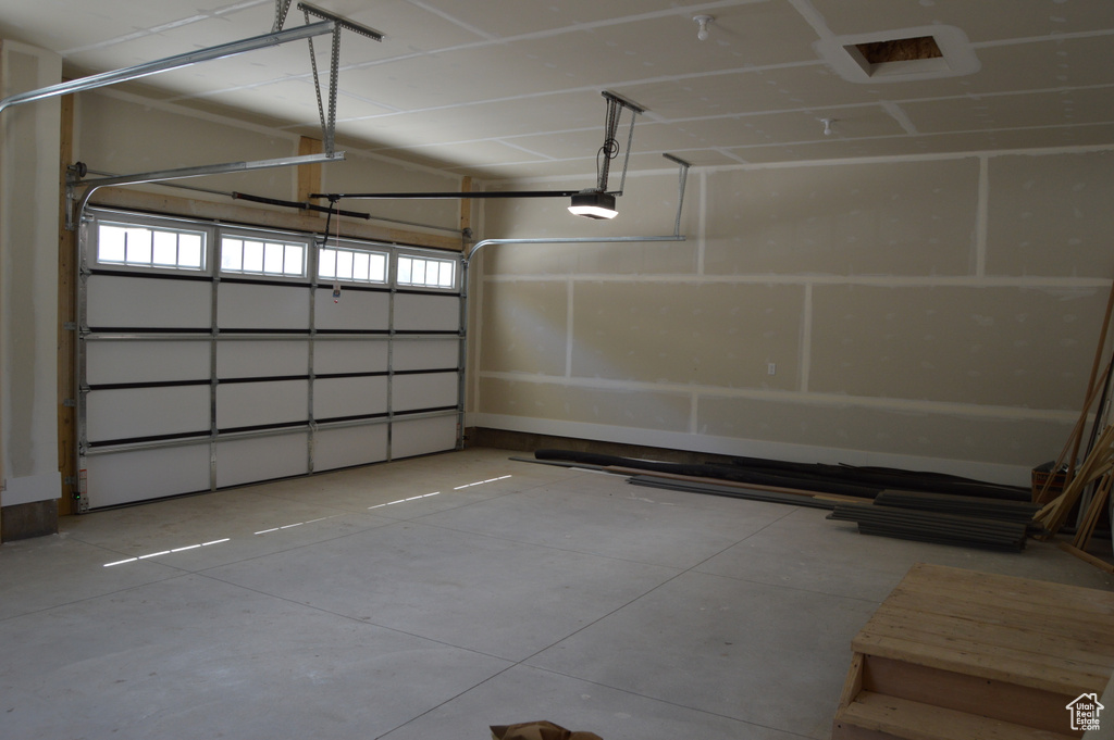 Garage featuring a garage door opener