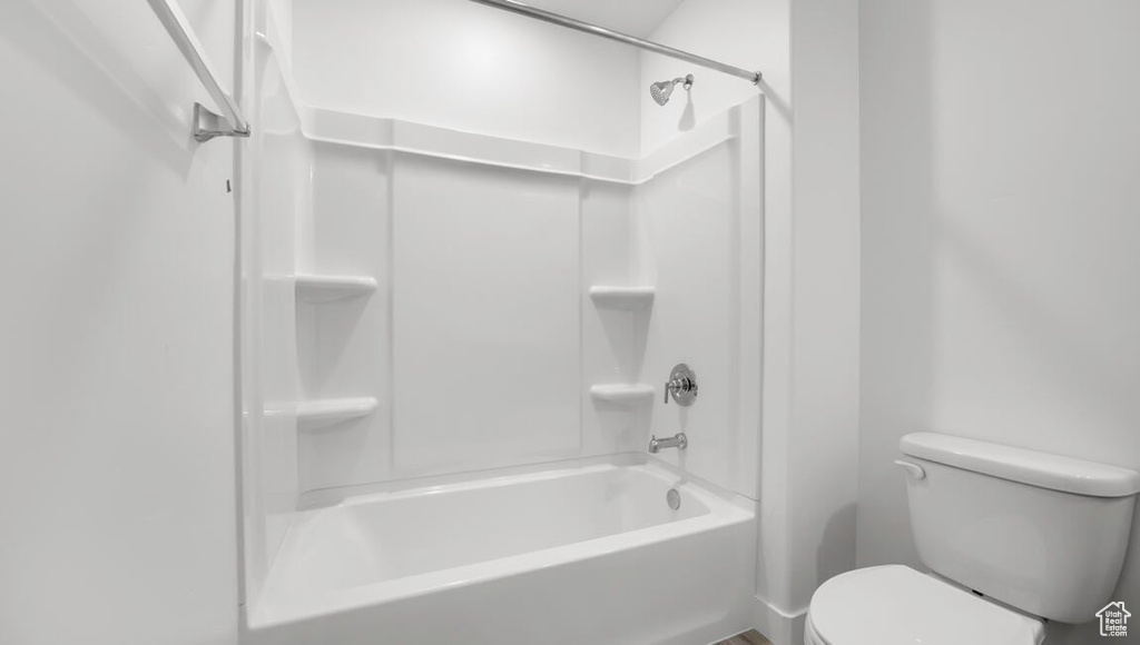 Bathroom with toilet and shower / bathtub combination