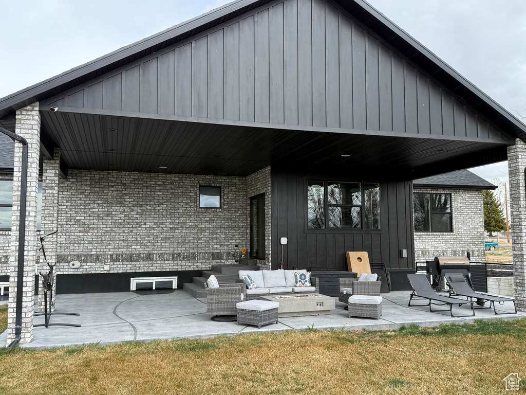 View of patio with an outdoor hangout area