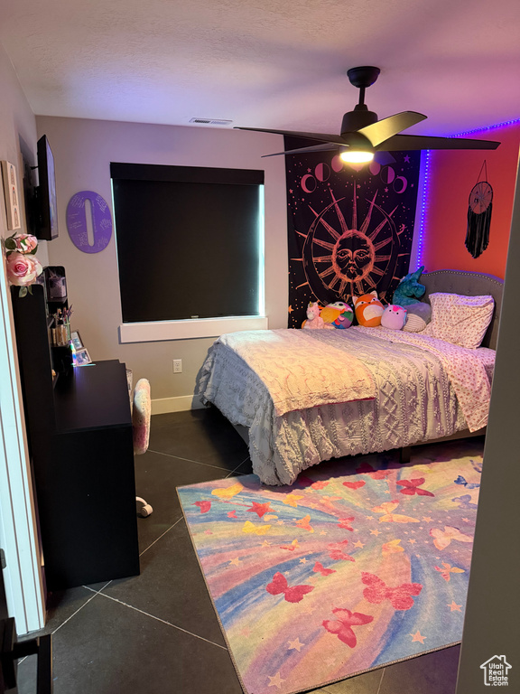Tiled bedroom with visible vents