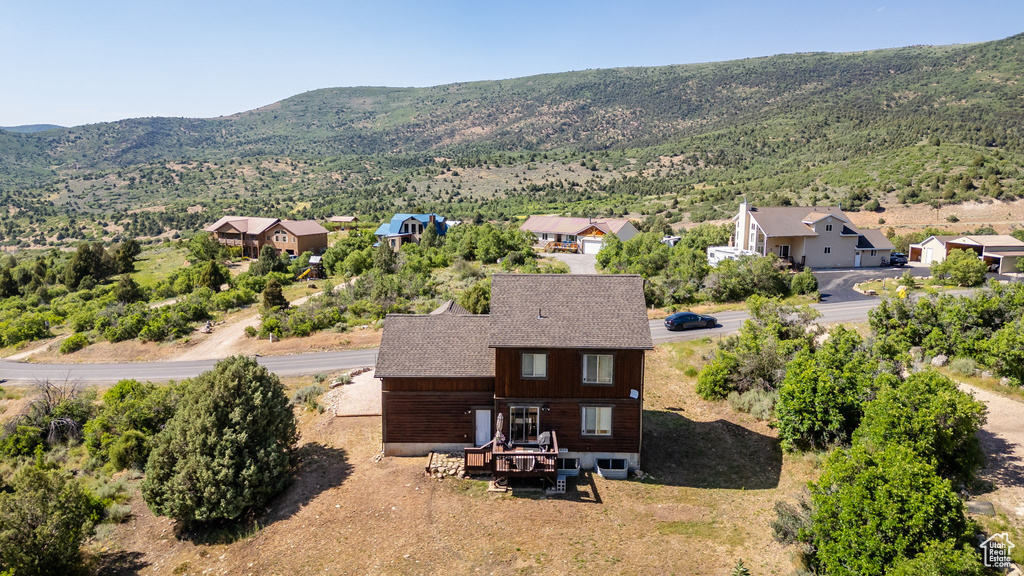 Aerial perspective of suburban area with a mountainous background